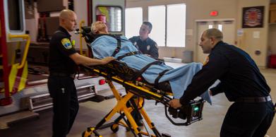 Paramedics helping patient